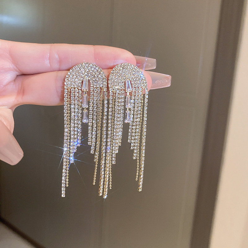 Pendientes de borla de hoja de circón largo de viento de metal con aguja de plata Pendientes de moda exquisita Pendientes de lujo ligero de viento frío