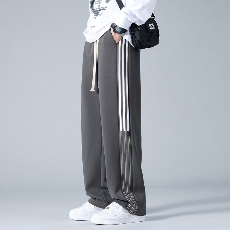 Pantalones deportivos a rayas estadounidenses para hombres y mujeres 2024 pantalones casuales rectos de cintura alta cuerdas sueltas pantalones al por mayor
