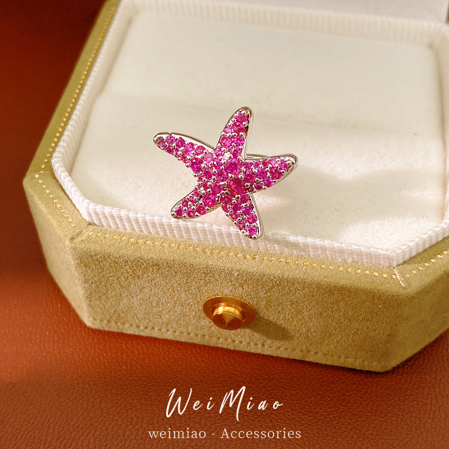 Zircon rojo rosa estrellas de mar orejas de orejas mujeres sin agujeros de orejas accesorios de vacaciones pendientes de moda ligero lujo alta sensación de orejas al por mayor