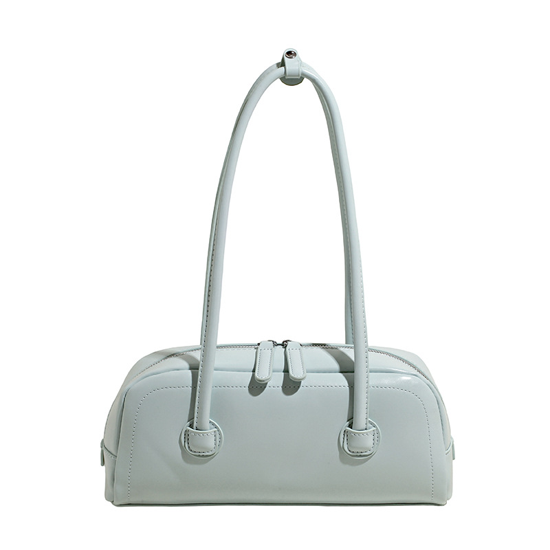 High-end nicho de moda bolso de hombro de mano para mujeres 2025 verano nuevo estilo simple bolso de viaje de palo bolso debajo de la axila