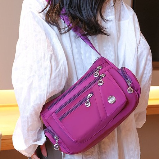 Moda multi-cremallera mochila casuales multicapa bolsa de mamá ligera 2024 nueva gran capacidad madre estilo extranjero hombro único