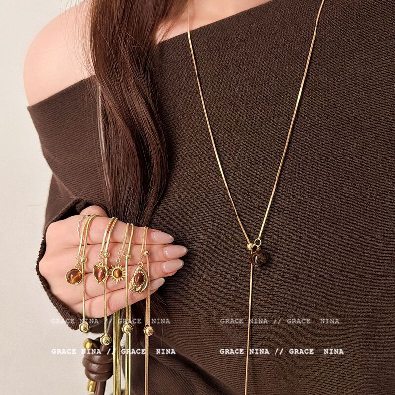 Autumn and Winter Retro Long Sweater Chain for Women, Maillard Tiger Eye Stone Pull-Out Necklace Accessories, Accessible Luxury and High-End Sense Autumn and Winter Retro Long Sweater Chain for Women, Maillard Tiger Eye Stone Pull-Out Necklace Accessories, Accessible Luxury and High-End Sense