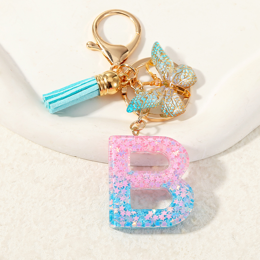 Europa y los Estados Unidos transfronterizos nuevos cristal sequinado goteo de goma letras inglesas joyería llavero y bolsos colgante apoyo al por mayor