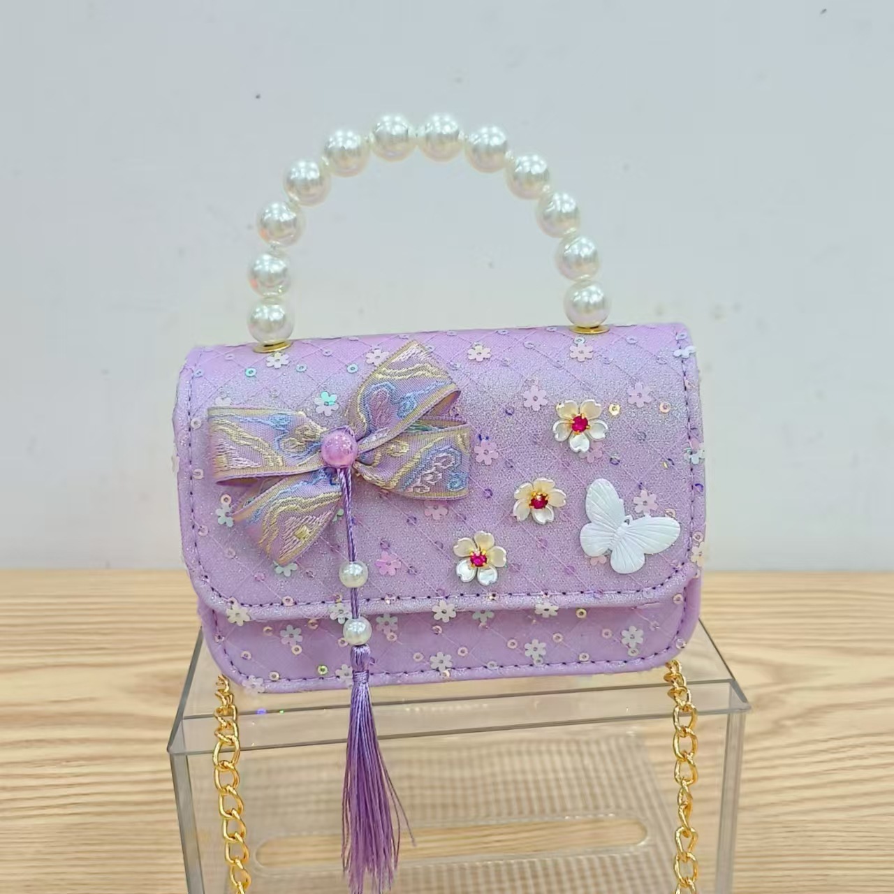 Niños pequeños viento fragrante hombro alto sentido de la chica antigua bolso de cambio princesa perla accesorios de ropa china portátil mochila