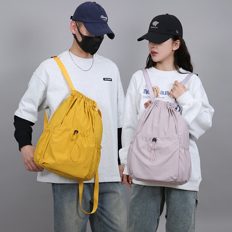 Mochila de cuerda ligera comercio exterior mochila al aire libre coreana de gran capacidad de mujeres viajes viajeros ociosos bolsa al por mayor