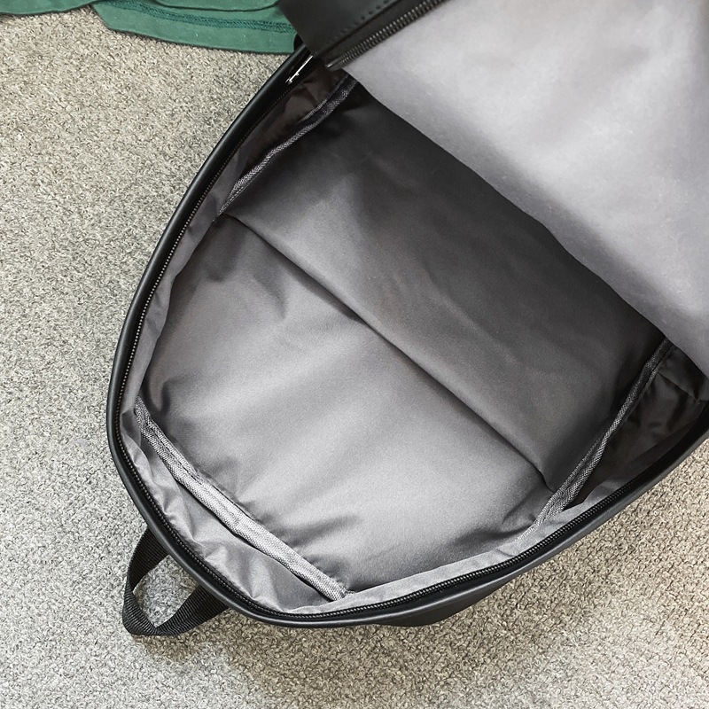 Comercio exterior al por mayor 2023 nueva versión coreana de la mochila de cuero suave para estudiantes de secundaria Mochila de computadora de gran capacidad de color sólido de moda