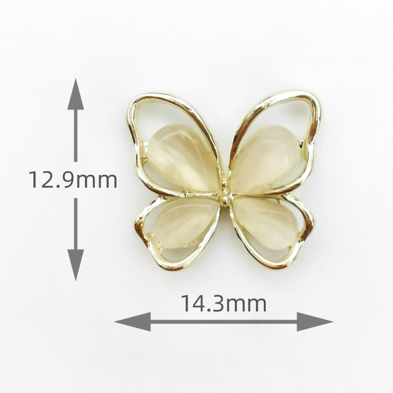 Nuevo hueco 3D Opal mariposa uñas joyería aleación rhinestone mariposa uñas etiqueta fábrica al por mayor