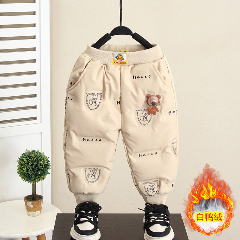 6911 pantalones de plumón de pato blanco para niños 2025 invierno nuevo niño pequeño patito amarillo pantalones gruesos de algodón para bebés marea