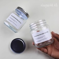 食品級円形空ガラス瓶蒸煮可能缶詰カプサイソース包装瓶蜂蜜瓶蓋付き透明密封缶