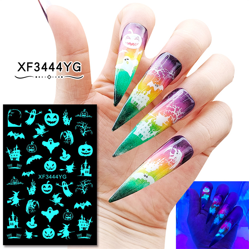 Nuevo 12 piezas un conjunto de pegatinas de uñas luminosas de Halloween divertidas pegatinas de uñas de cráneo de calabaza traje