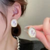White earrings, flowered