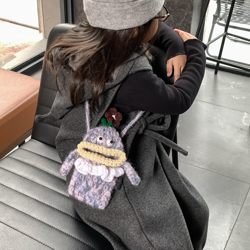 Otoño y invierno nuevos bolsos infantiles, boca de salchicha feia, lindos bebés mochilas, productos terminados ganchos, bolsos de hombro para niños y niñas