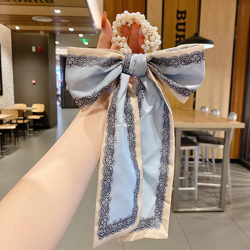 Banda de pelo de bufanda de seda corbata de pelo femenina Shixi Cinta de lazo de perla sale todo partido cuerda de cabeza Shixi 2021 cabello nuevo