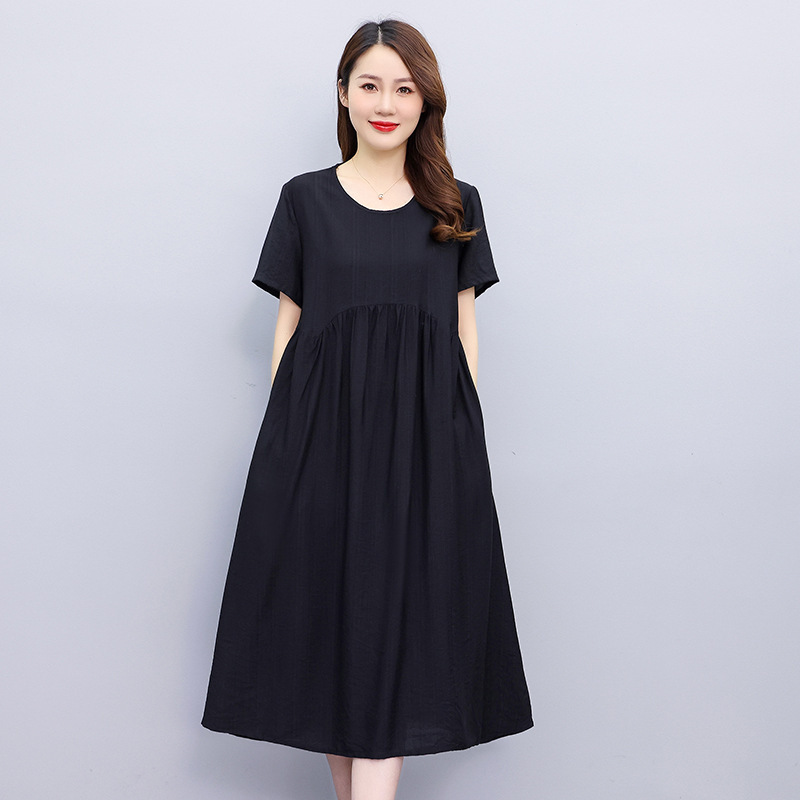 夏の新型純色半袖綿のワンピースの女性ファッションのお母さんの服はやせてゆったりしている気質の中の長いスカートを現します。|undefined