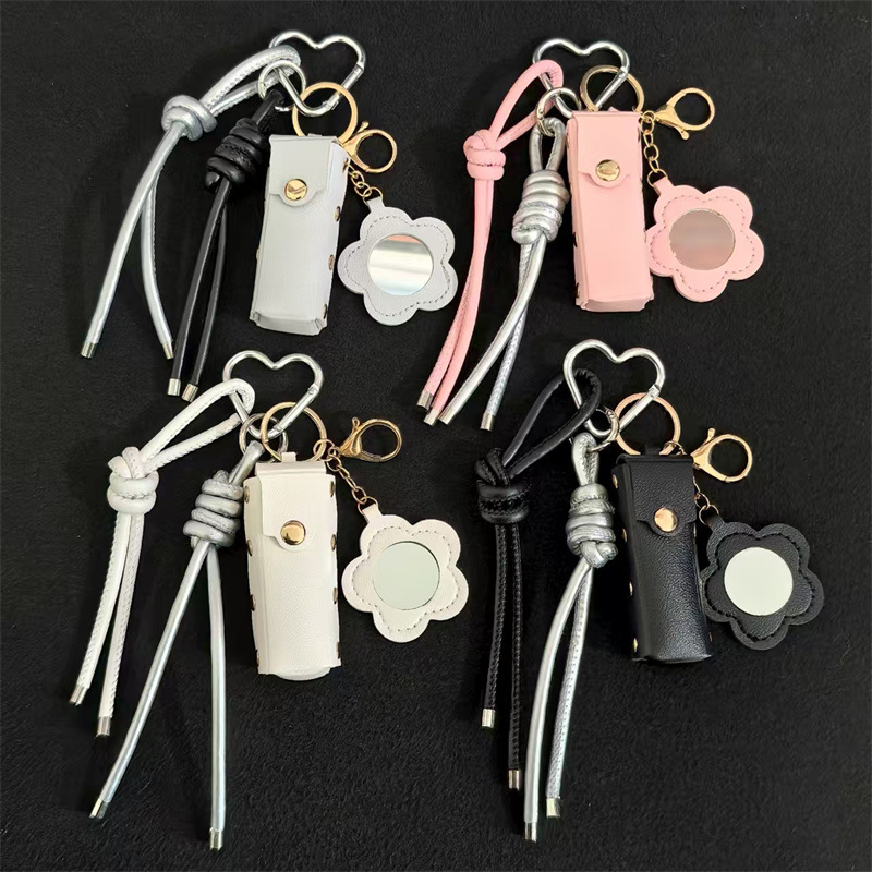 Espejo de cuero transfronterizo lápiz labial bolsas de llaves creativas flores portátiles maquillaje espejo bolsas colgantes accesorios de llaves PU