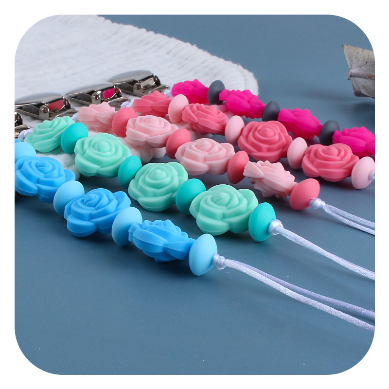 Suministros para bebés nuevo clip de chupete de hierro redondo mordedor para bebé Cadena de chupete de silicona Rosa cadena anti-caída