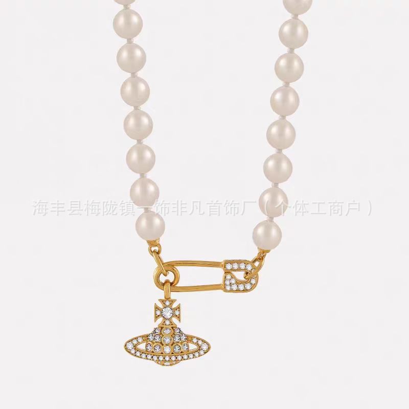 Golden pin, necklace from pearl