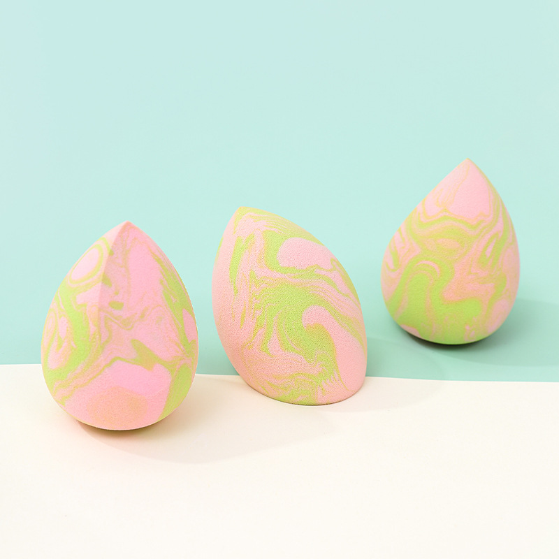 La borla de polvo de huevo de belleza de color mixto transfronterizo se agranda cuando se encuentra con el agua, gotas de agua sin látex, esponja de maquillaje en forma de calabaza, personalización de fábrica de huevos