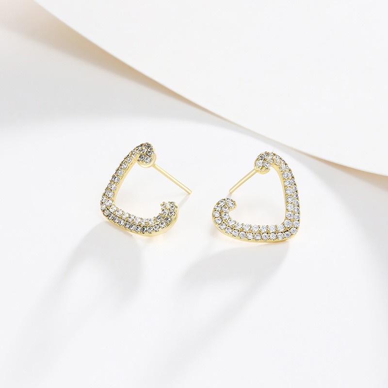 Xupin joyería micro incrustaciones de circonio chapado en oro de 14K pendientes en forma de corazón de alto grado sentido nicho hueco temperamento pendientes encantadores