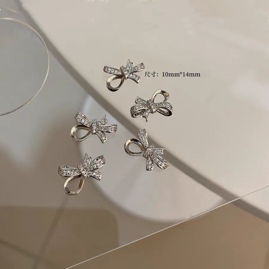 Celebridad de Internet nuevos accesorios de uñas Iris arco de alta retención de color ajuste arco de uñas diamante desgaste material de uñas diamante