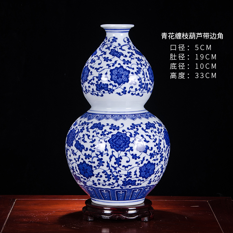 모서리 + 나무 베이스가 있는 파란색과 흰색 조롱박 병