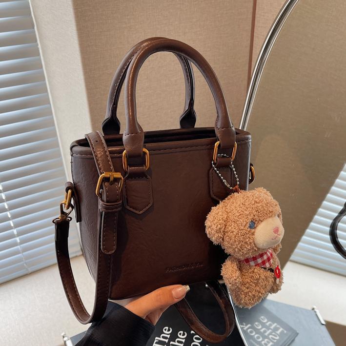 Bolsa de balde para mujeres 2024 nuevo retro versátil bolso de hombro portátil otoño-invierno súper caliente nicho de diseño de alta calidad bolso de mujer