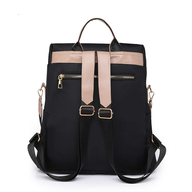 Fábrica al por mayor 2023 nueva versión coreana de la mochila de nailon para mujer moda literaria color de contraste viaje mochila de doble uso marea