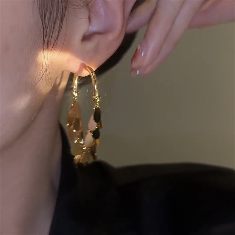 Nicho diseño de la industria pesada borla pendientes de lentejuelas Alto sentido delantero y trasero desgaste de Internet pendientes de la celebridad elegante luz de lujo del todo-fósforo pendientes