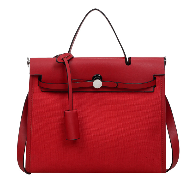 Nicho de moda portátil Kelly bolso mujer 2026 nuevo cross-border lienzo empalme color contraste viaje mochila de hombro