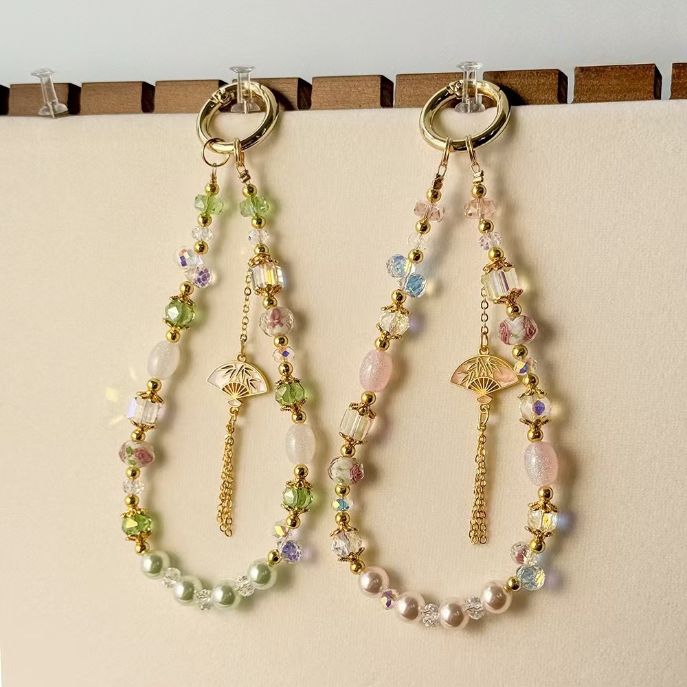 China ventilador de aleación de viento flange caja de teléfono móvil cuerdas manuales esmaltado cristal bolso de cadena de teléfono móvil colgante