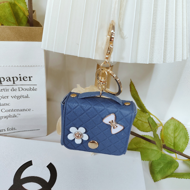 Nuevo estilo transfronterizo, moderno y exclusivo mini bolso acolchado tipo colgante, monedero para llaves, accesorio para auriculares.