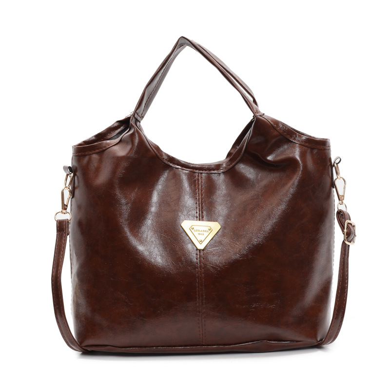 Tide retro nicho bolso de mano mujer 2025 primavera nueva piel de cera de aceite de transporte de gran capacidad bolso de hombro mochila