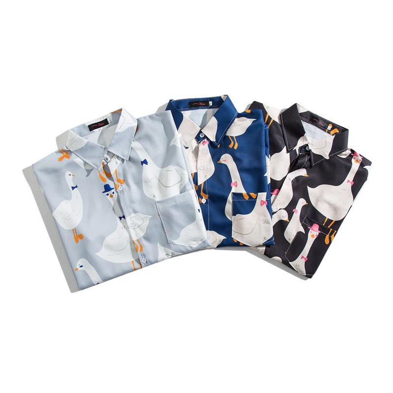 Estilo japonés retro completo impreso de dibujos animados camisa de manga corta de verano de los hombres Harajuku estilo suelta pareja desgaste Ruan guapo camisa de media manga