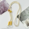 Adjustable long rope-beige rope yellow knot