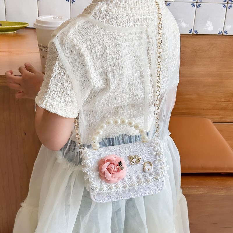 Nuevo bolso infantil, bolso de moda de perlas, bolso de hombro de flores de niñas, bolso de moda de cadena, mochila pequeña