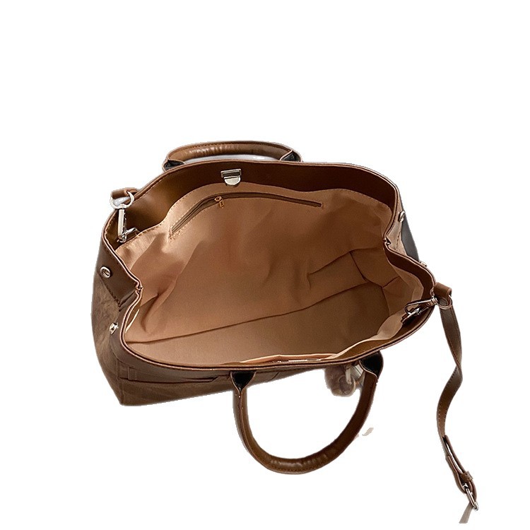 Bolso de mano retro de otoño y invierno para mujeres 2025 nuevo estilo de alta calidad de la bolsa de transporte de viaje empalmado bolso de hombro