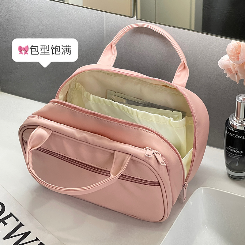Nueva bolsa de maquillaje portátil coreana, bolsa de almacenamiento portátil de gran capacidad para mujeres, bolsa de almacenamiento para productos de cuidado de la piel, bolsa de lavado, bolsa de almacenamiento