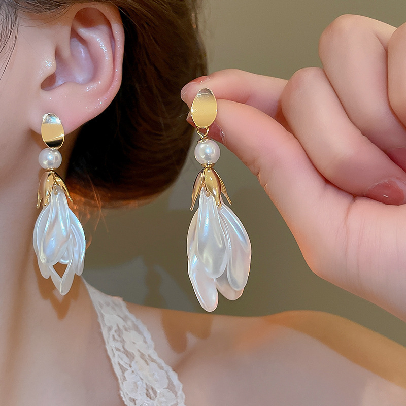 Pendientes de flor de lazo elegante de súper hada de plata Pendientes de moda de lujo ligero francés Pendientes de todo fósforo dulce de estilo literario