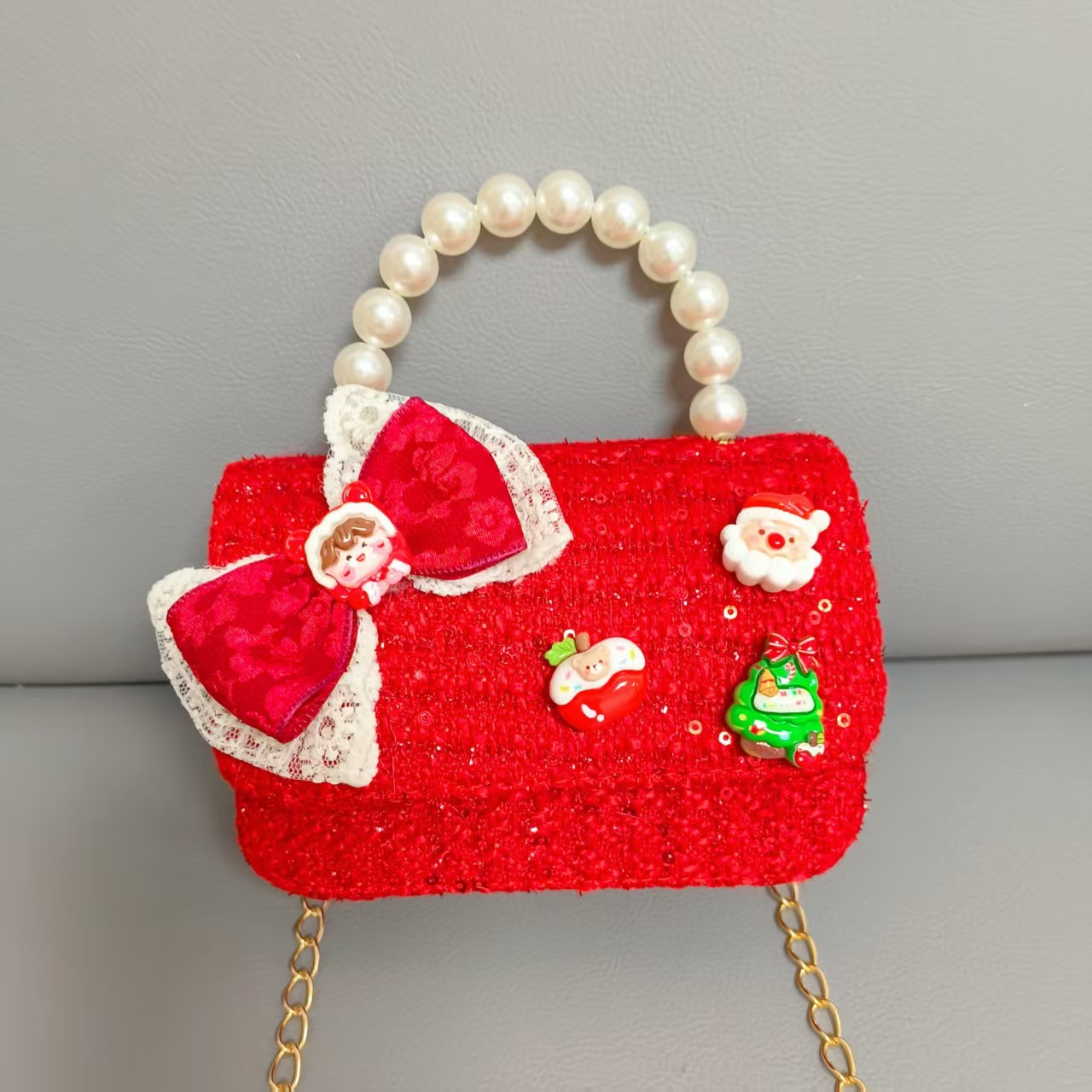Cartera de Año Nuevo rojo arco de papá Noel bolso de perla pequeña cadena de viento fragante bolso de hombro