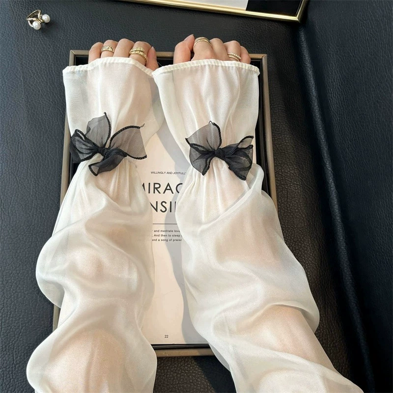 Ледяной шелк солнцезащитный рукав женский 2025 новый лук летний ручной рукав анти-УФ перчатки широкий фея ветер ледяной рукав