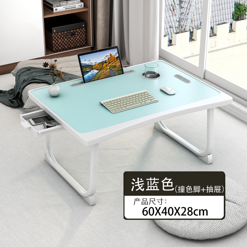 ベッドの上の机のノートパソコンの机は折りたたみ可能です。|undefined