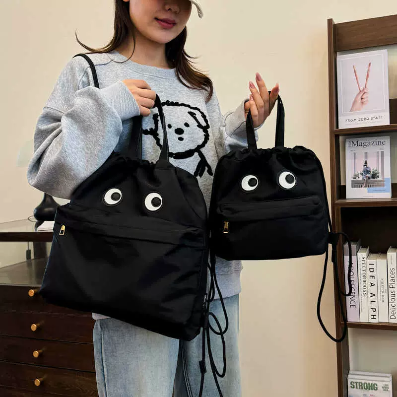可爱搞怪女士双肩包2025新款印花休闲出街手提包学生少女时尚背包