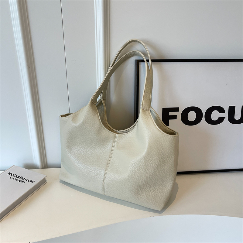 Bolsa de cuero suave transfronteriza para mujeres de gran capacidad 2025 nueva bolsa de hombro simple de textura casual