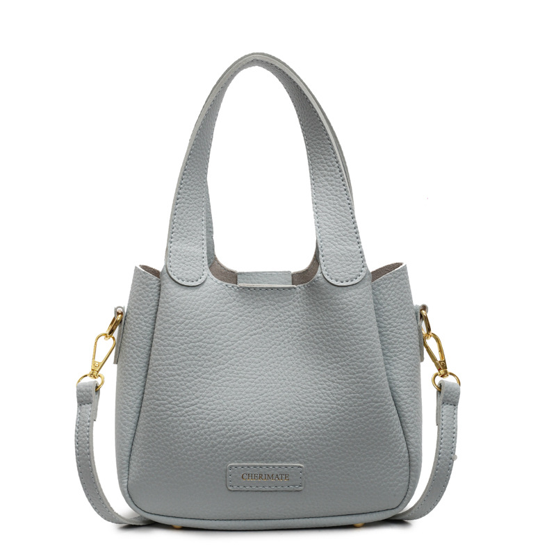 Bolsa de mano ocio transfronteriza versátil para mujeres 2025 nuevo estilo popular retro bolso de cubo de alta calidad simple mochila