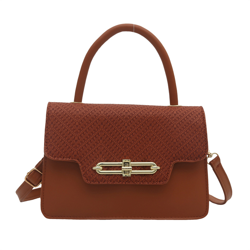 Bolso pequeño portátil casual retro femenino 2025 nuevo bolso cuadrado pequeño de moda coreana textura hebilla bolsa de mensajero de nicho