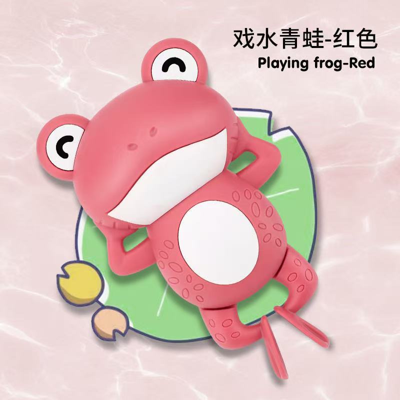 Red frog playing in water