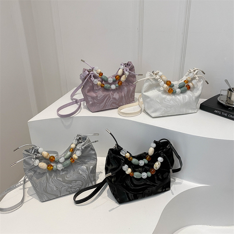 Nueva bolsa de estilo chino para mujeres 2024, nuevo verano, bolso de mochila de estilo exterior, bolso de cubo portátil super caliente.