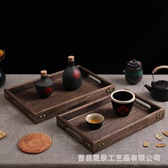 桐の木のトレーの木造の炭はお茶の皿を焼きます。
