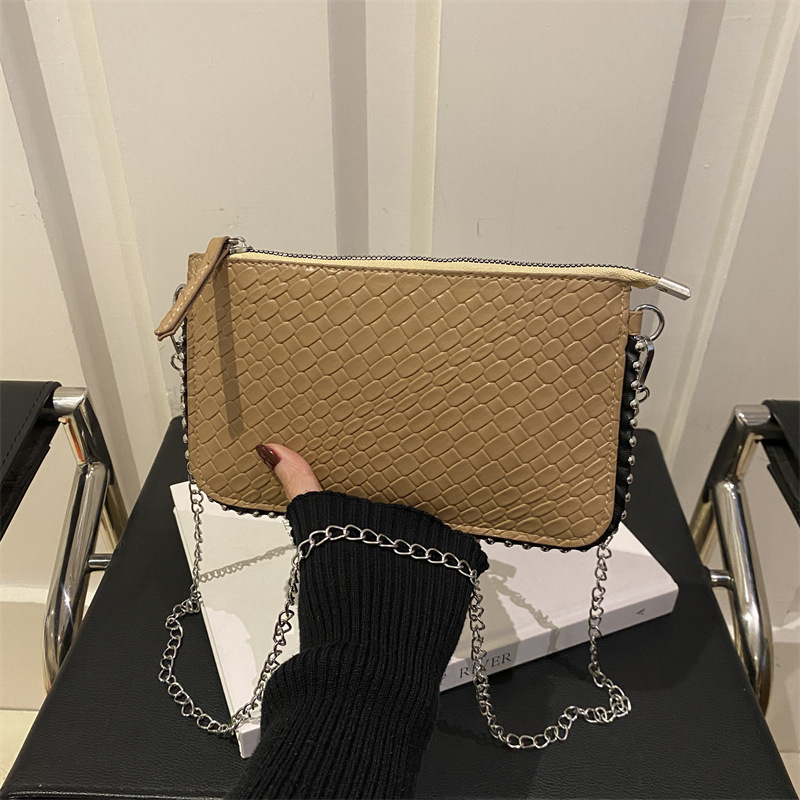 Diseño de moda bolso de hombro tejido estilo occidental color sólido 2025 nuevo temperamento retro fresco textura de axila bolso de mensajero