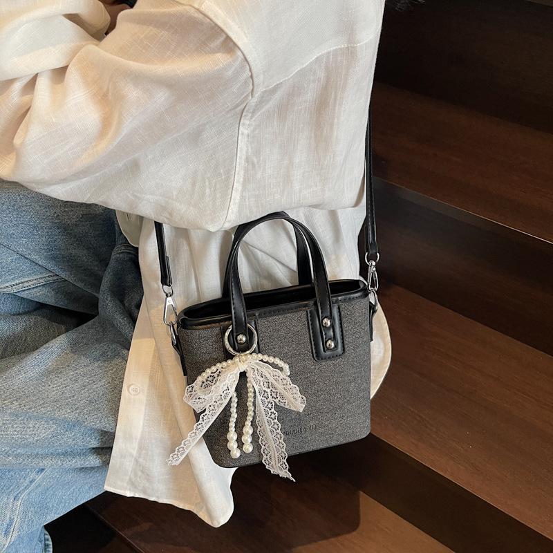 Bolso de cubo de mano de estilo occidental de moda para mujer 2025 nuevo bolso de hombro de todo fósforo de color de contraste bolso de mensajero de viaje de textura de moda